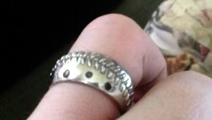 My custom baseball lace and black diamond wedding ring designed by my wife.